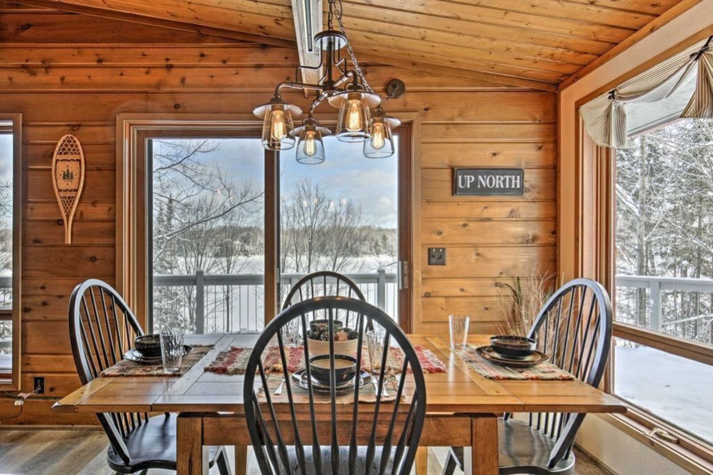 Dining table with lake view through large windows
