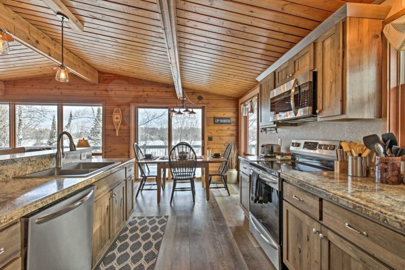 Kitchen with stainless appliances and the dining area beyond