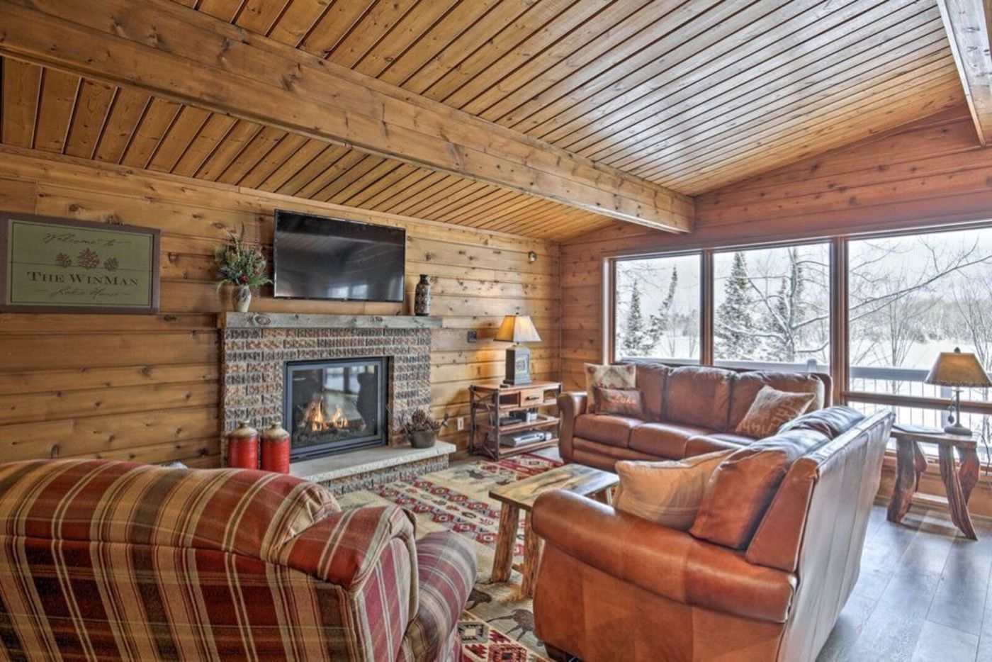 Living room with gas fireplace and leather sofas